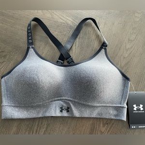 UA adjustable, medium support sports bra. New, with tags, never worn